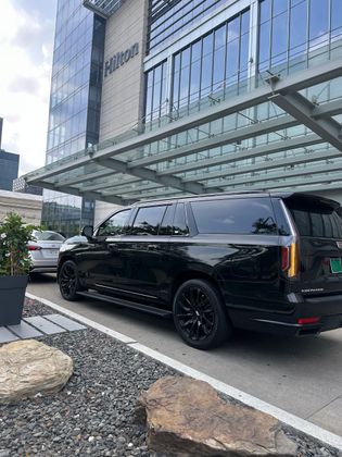 The exterior of the Midway International Airport sign at the departures during sunset.