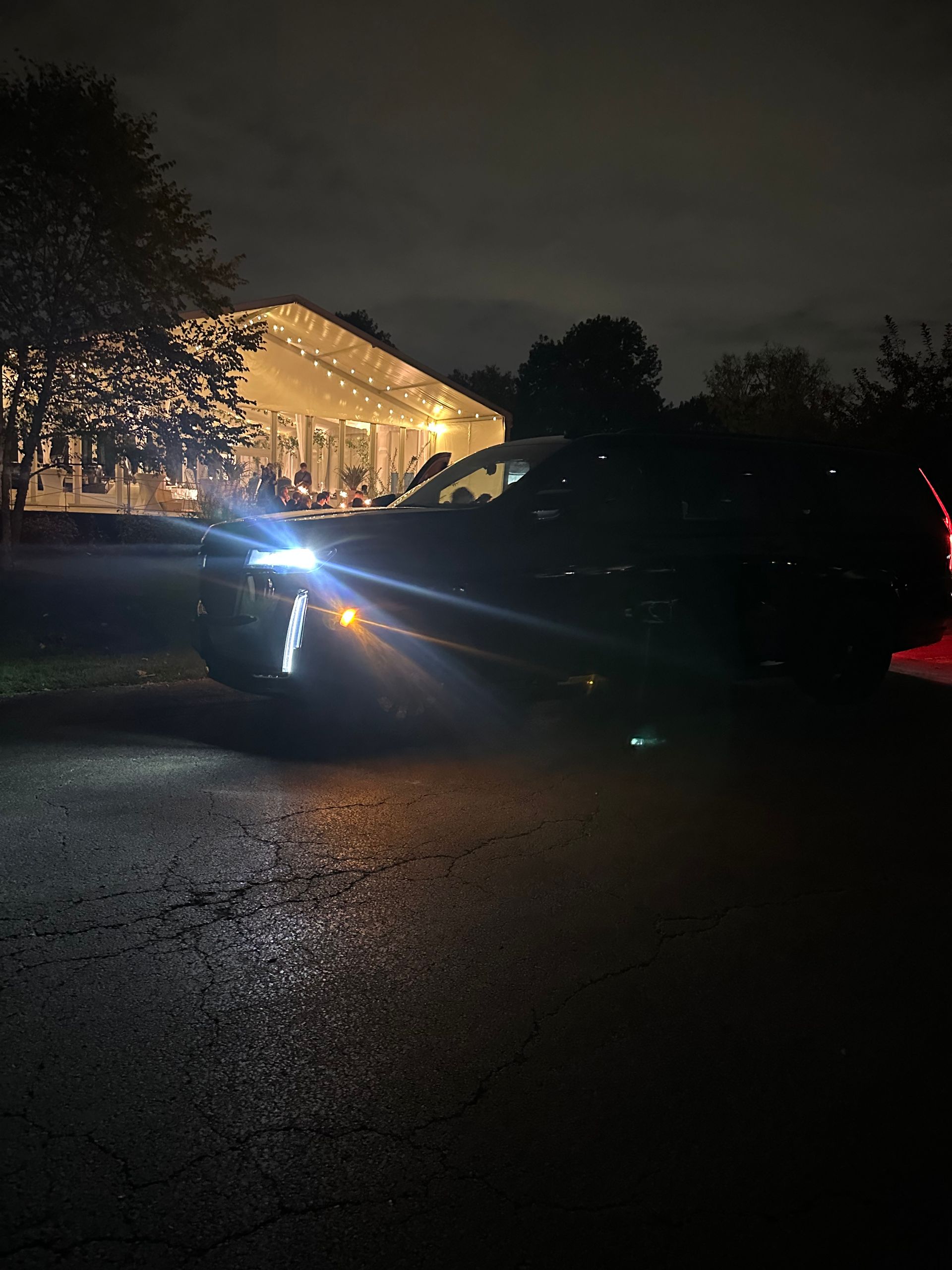 Cadillac Escalade parked at Woodside Pavilion in Woodridge for a wedding event by M.R. Black Car Service.