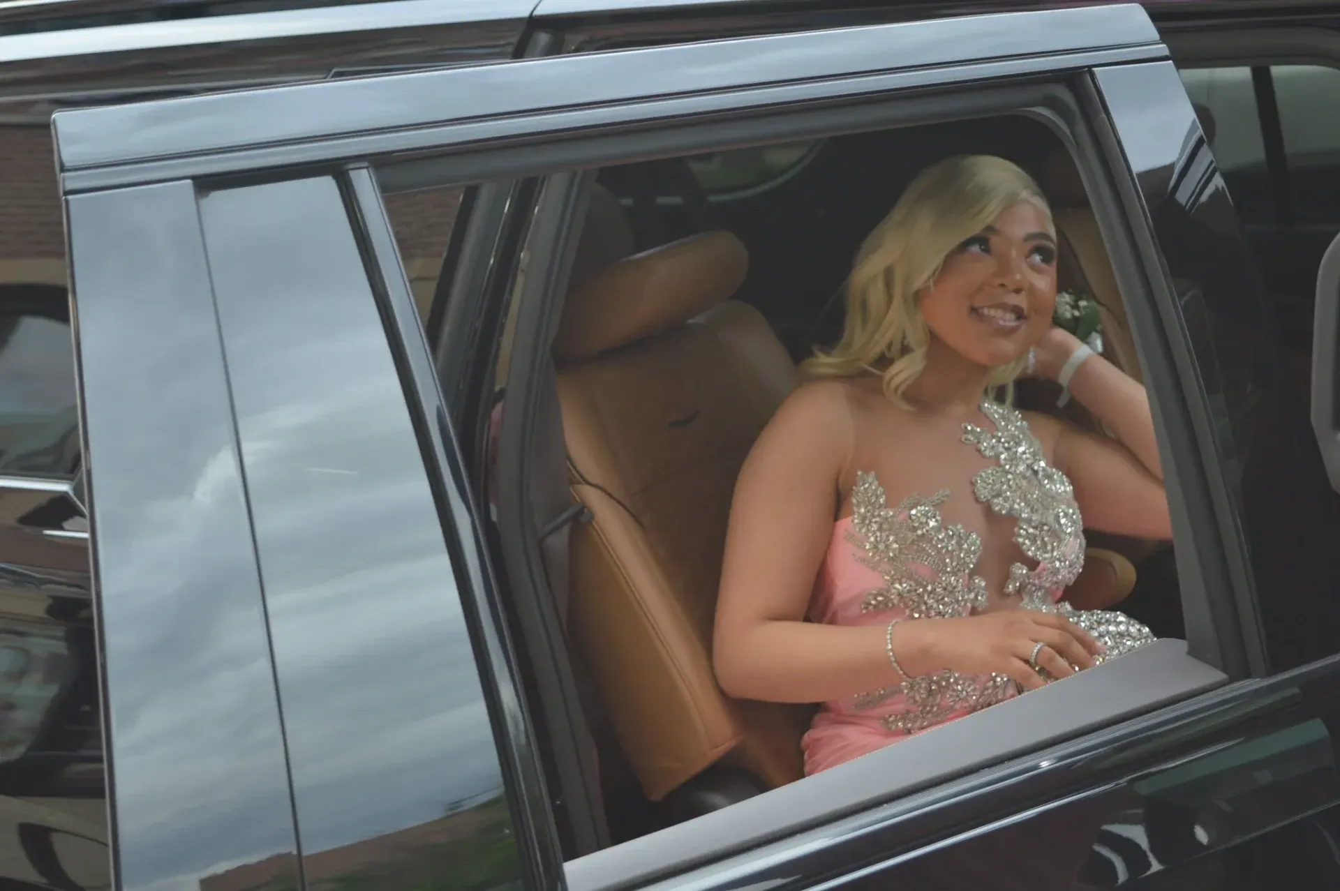 Teenager in a Cadillac Escalade as she is headed to her Prom in Chicago