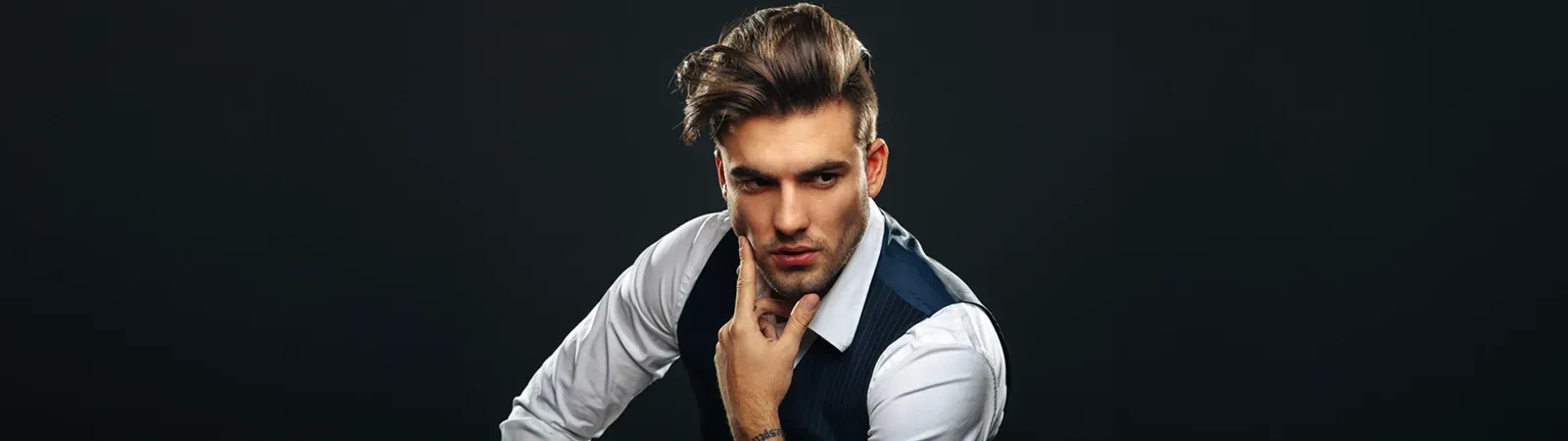 A confident, handsome man in his 40s with subtle, natural-looking Brotox results