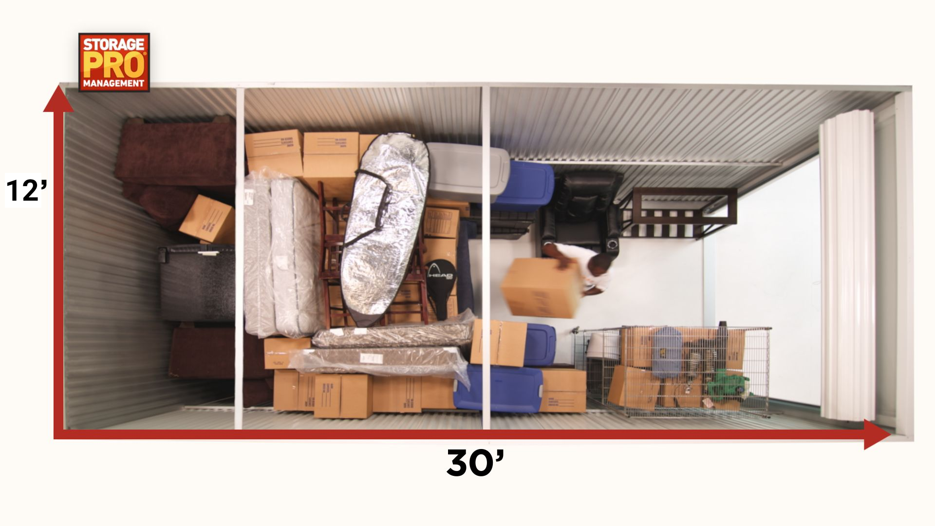 Top-down view of a 10x30 foot storage unit filled with various boxes, furniture, and rolled-up items.