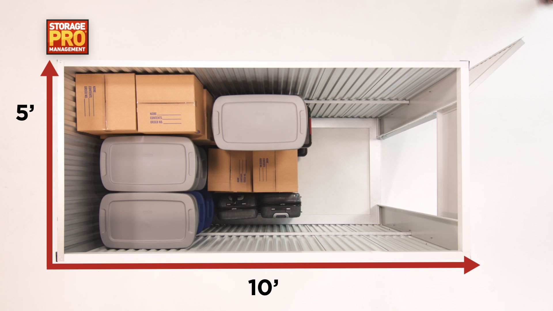 A storage unit with boxes and bins inside. The unit is 5' high and 10' wide.