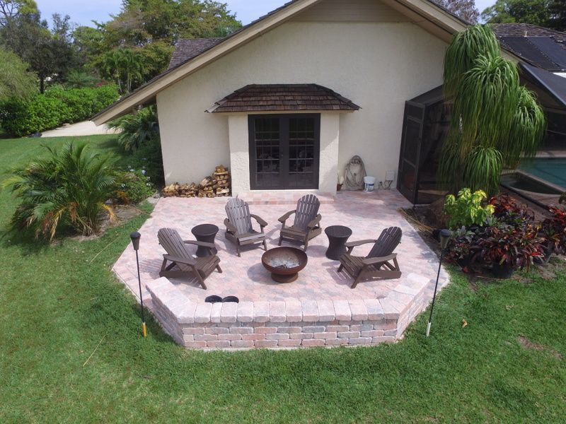 patio with brick paving and fire pit