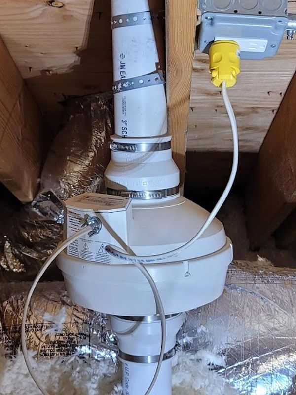 A white pipe with a yellow plug attached to it.