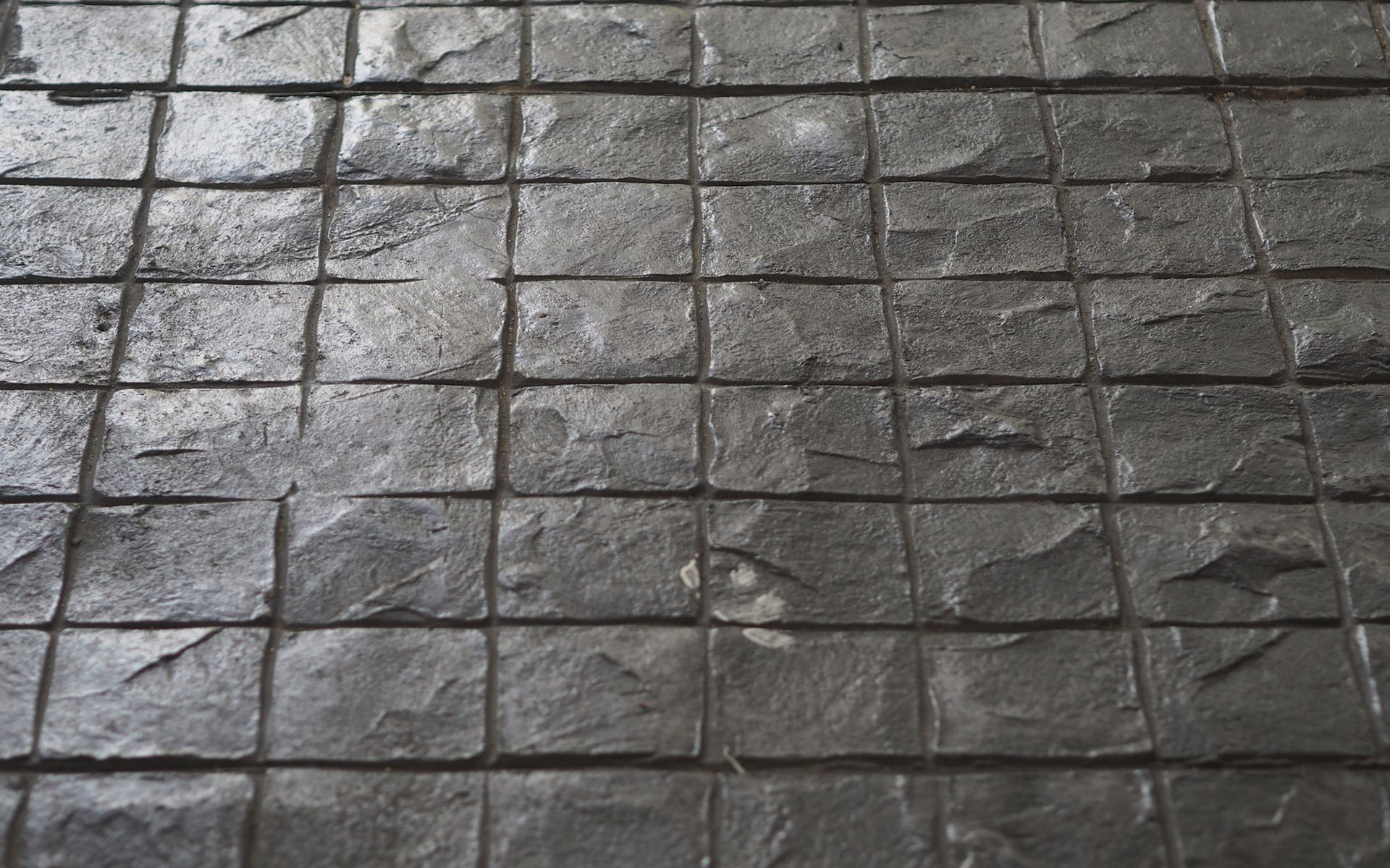 A black and white photo of a tiled floor