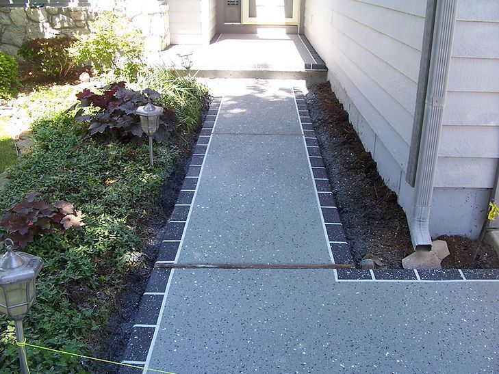 A walkway leading to the front door of a house