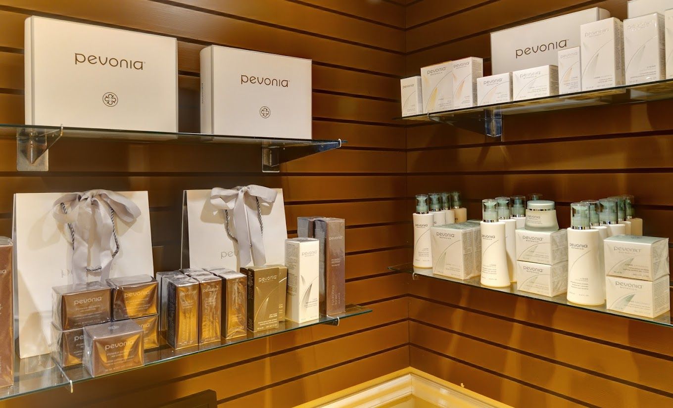 A room with shelves filled with boxes and bottles of cosmetics.