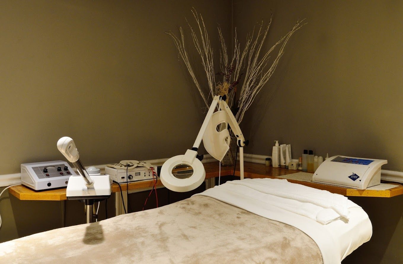 A massage table in a room with a lot of equipment on it