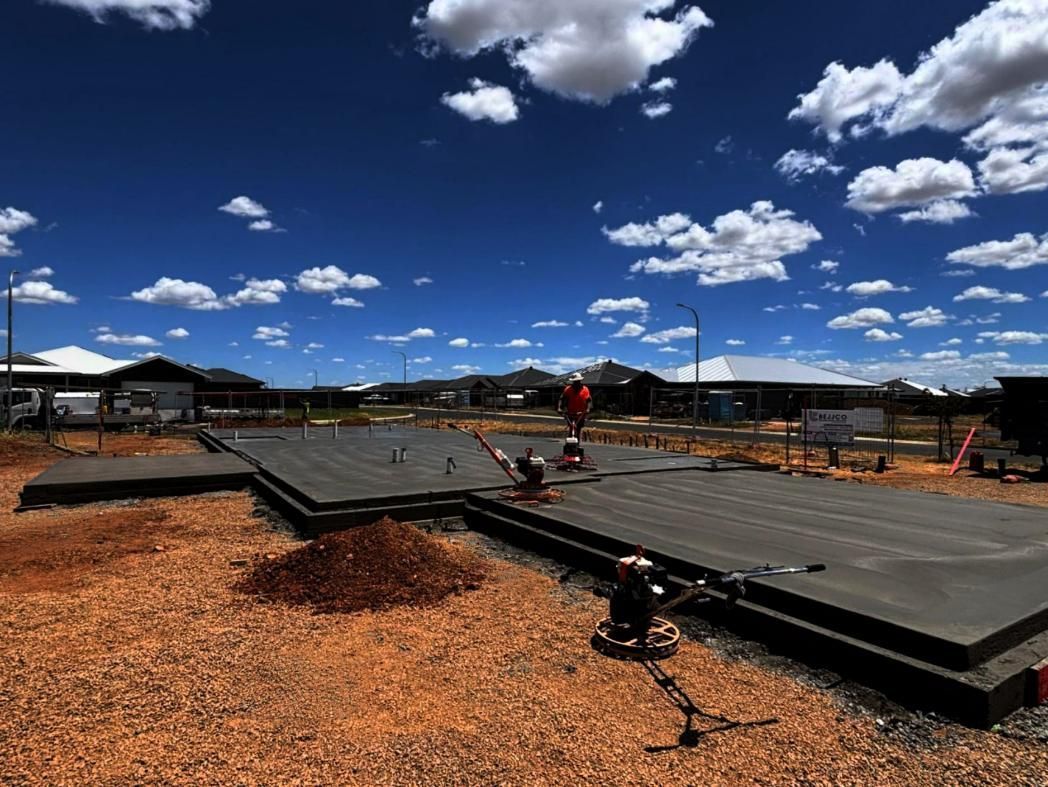 A Construction Site with A Blue Sky and Clouds — Spencer's Landscape Construction & Concreting Pty Ltd in Dubbo, NSW
