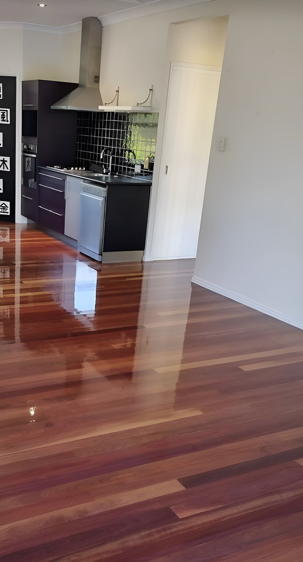 A Kitchen With A Wooden Floor And A Stove — European Floor Sanding In Mount Louisa, QLD