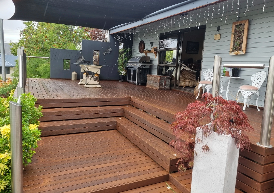 A Wooden Deck With Table, Chairs & a BBQ — European Floor Sanding In Mount Louisa, QLD