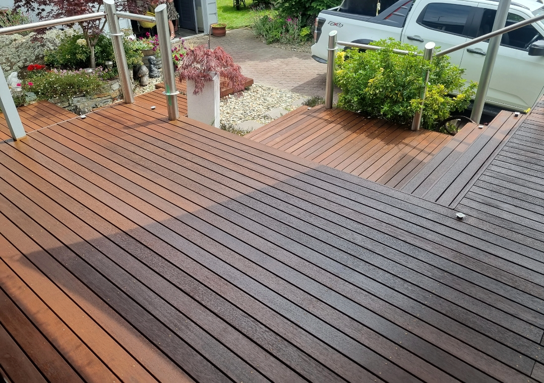 Stained Wooden Deck With Garden   — European Floor Sanding In Mount Louisa, QLD