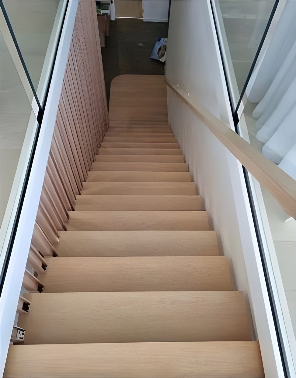 Looking Down a Set of Wooden Stairs With a Glass Railing — European Floor Sanding In Mount Louisa, QLD
