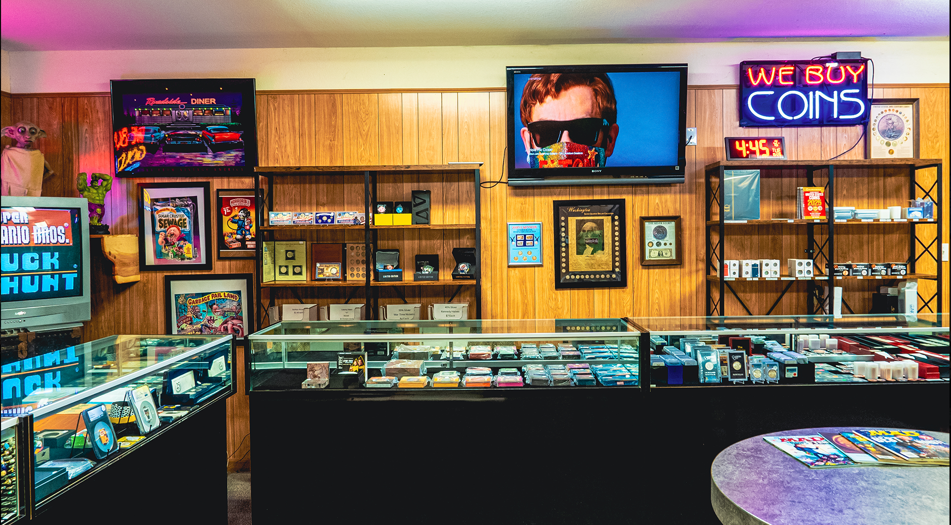 Inside a store, with display cases of games, shelves of merchandise, and a