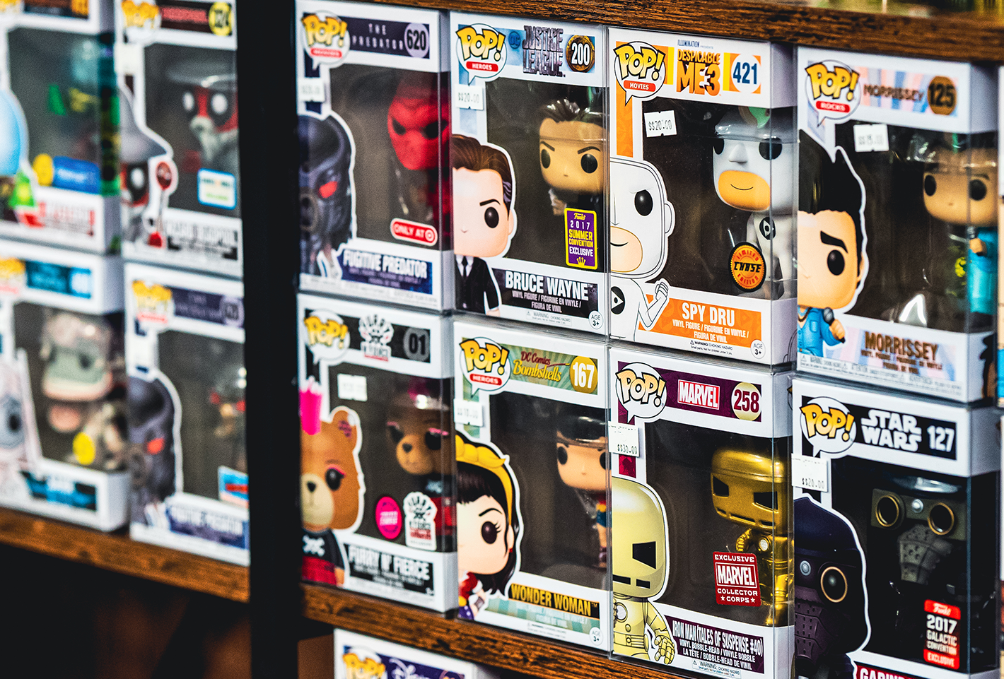Rows of Funko Pop figures on shelves, featuring various characters from movies and TV shows.