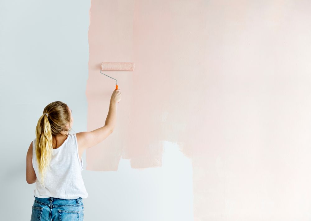 Woman Skillfully Painting a Pink Wall  — Painters in Byron Bay, NSW 