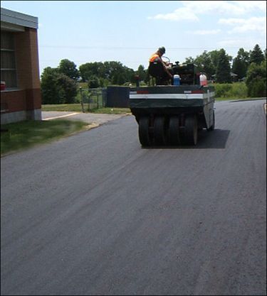 paving machine on new paved road