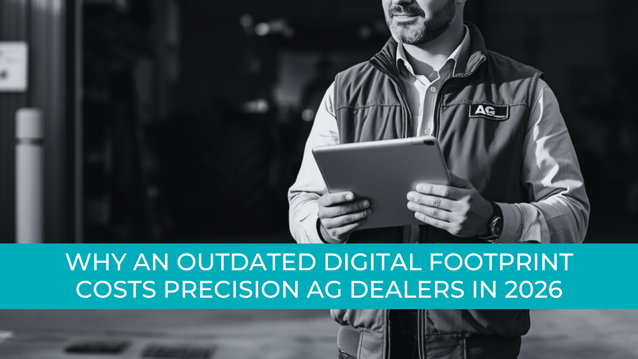 An dealership owner standing in front of a service bay looking at a tablet, warm natural lighting.