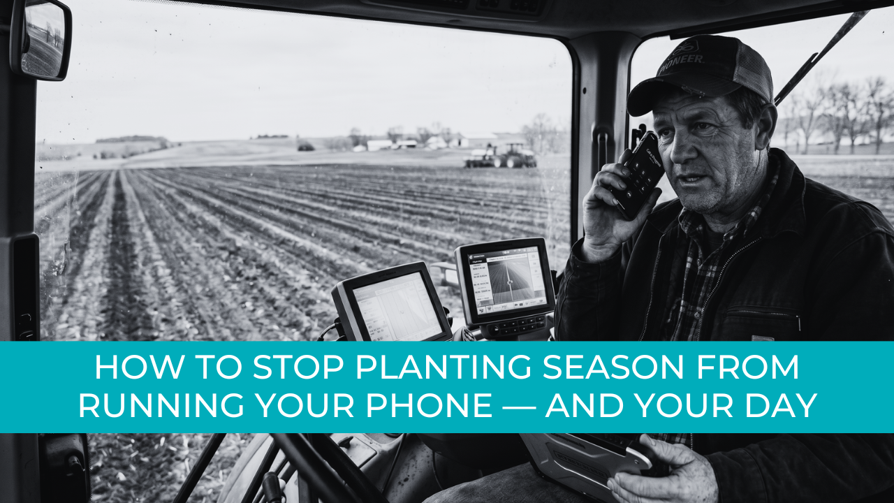 A busy grower on the phone and holding a tablet, looking out at a field during planting season