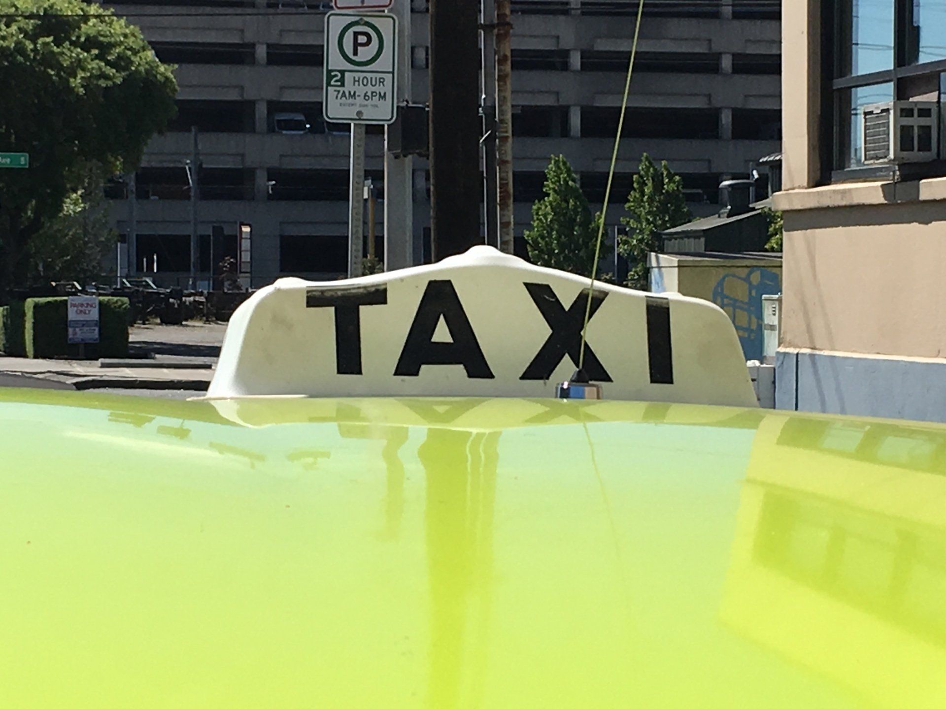 Yellow Taxi On A City Street With A Passenger — Seattle, WA — Farwest Taxi