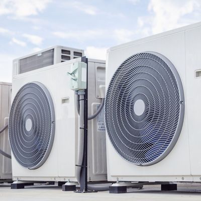 ProTech Athens | two air conditioners are sitting next to each other on a rooftop