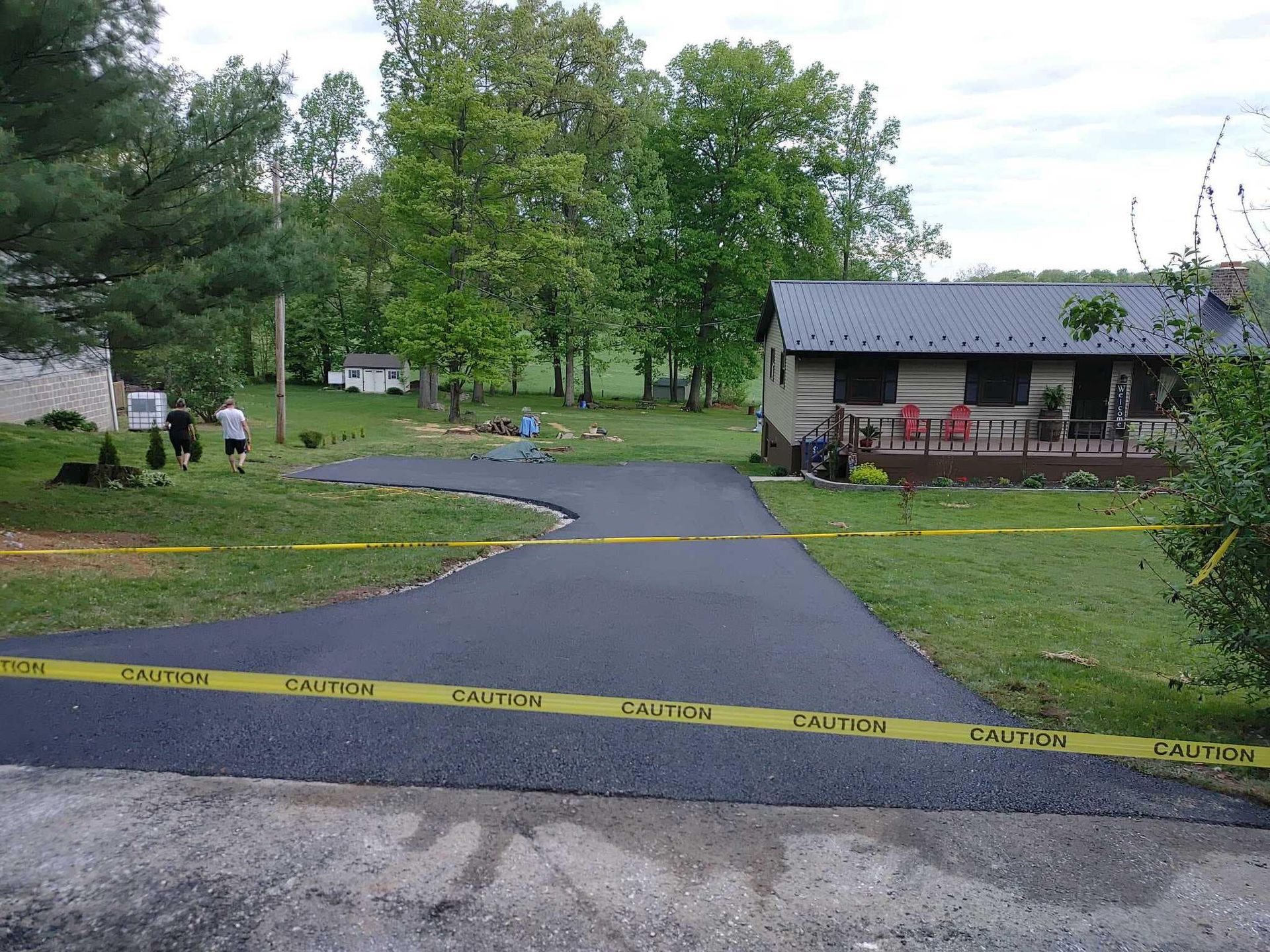 A house with a driveway that is being paved