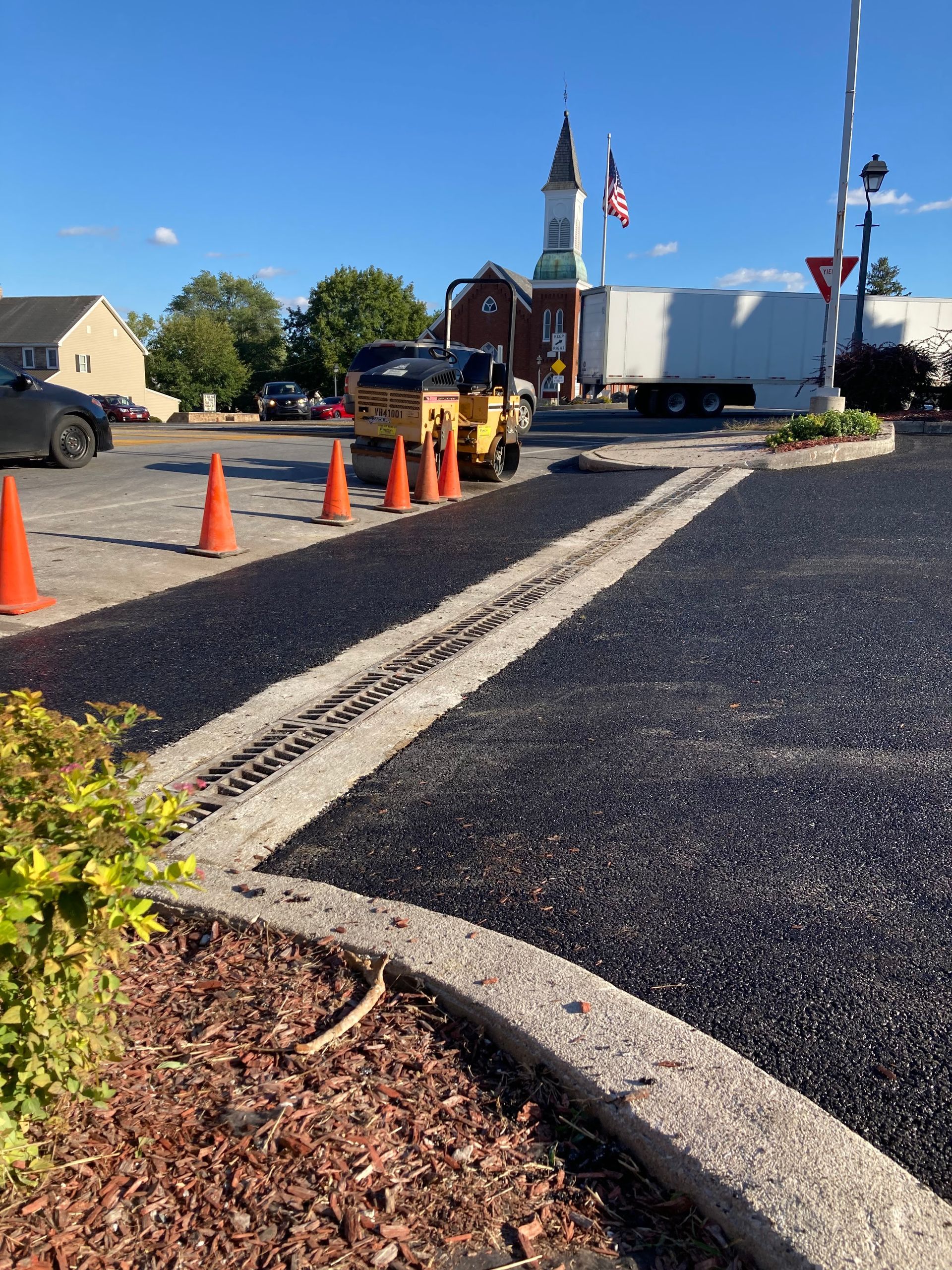 A large white truck is parked on the side of the road