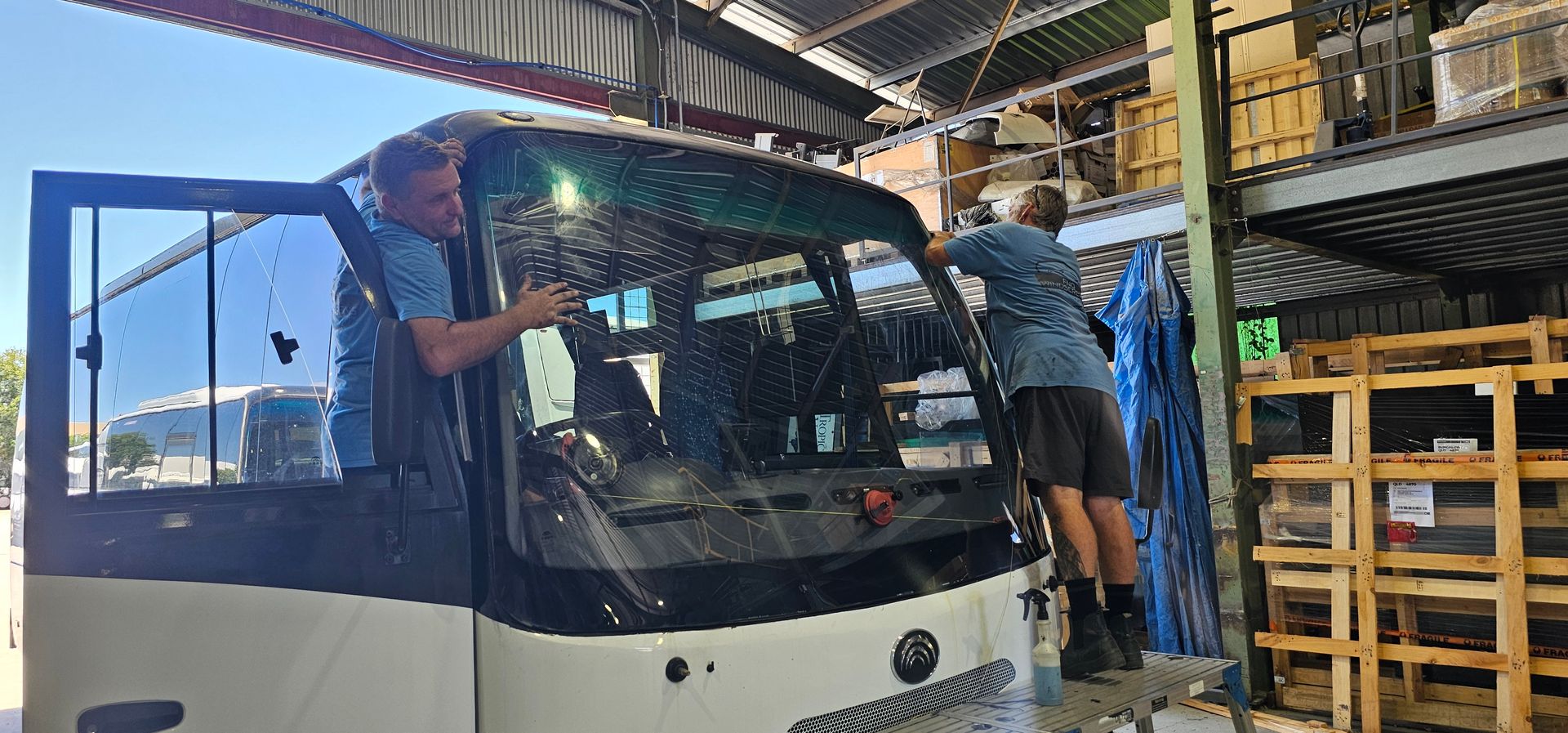 A Man Fixing A Car — FNQ Windscreens in Bungalow, QLD