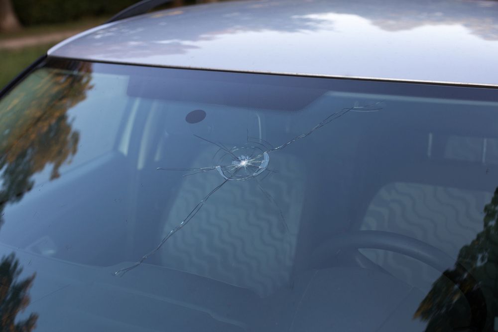 A Close up Of a Broken Windshield on A Car — FNQ Windscreens in Bungalow, QLD