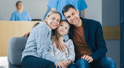 Dental Insurance Plans — Happy Family Visiting a Hospital in Mansfield, TX