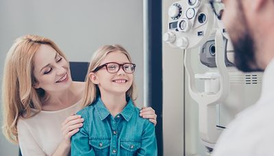 Vision Insurance — Mother and Daughter with Ophthalmologist in Mansfield, TX