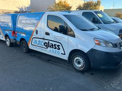 A row of Auto Glass 2020 vans are in Chandler AZ, getting ready to do mobile windshield replacements.