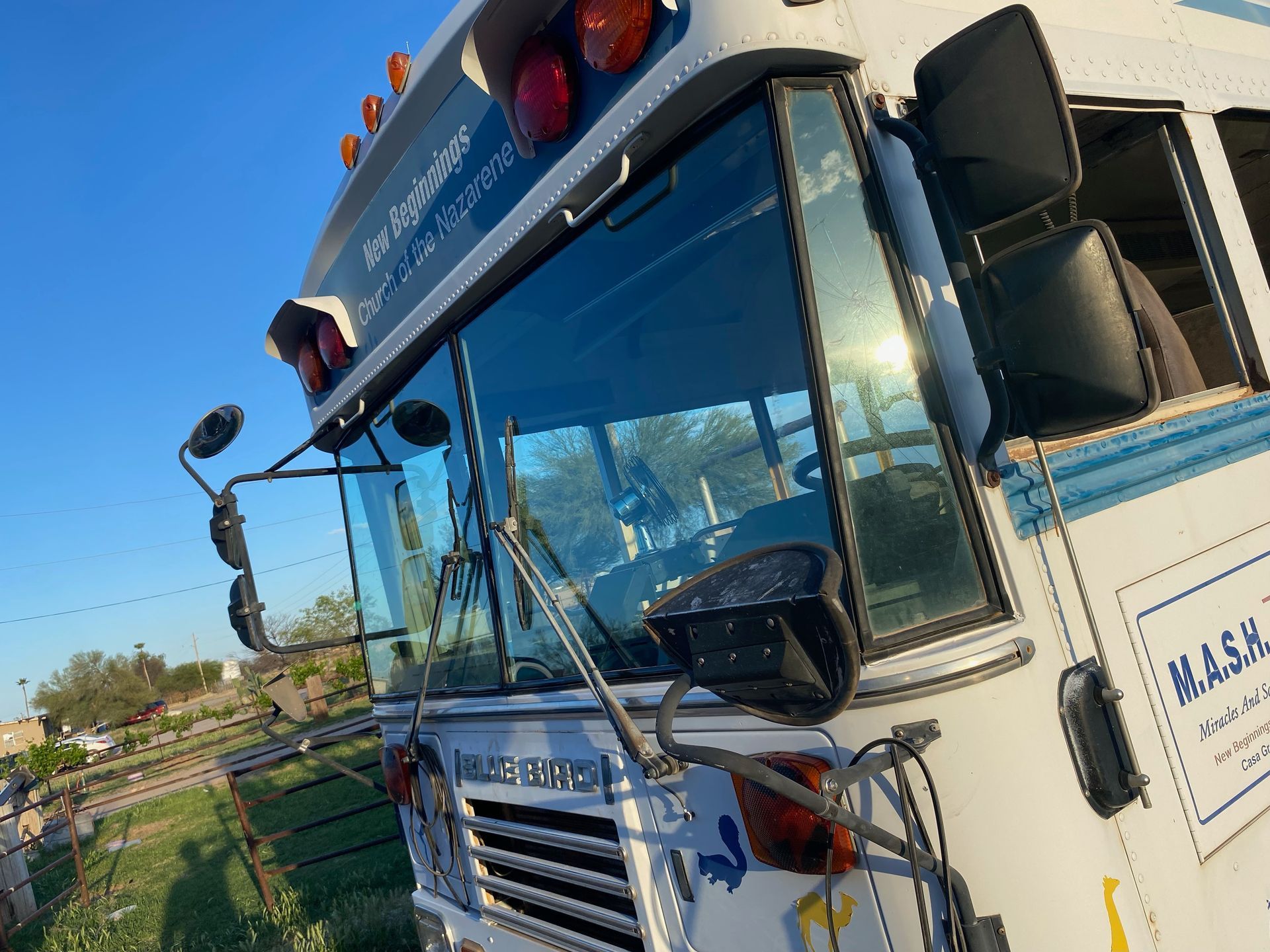 A white bus with the word mask on the side