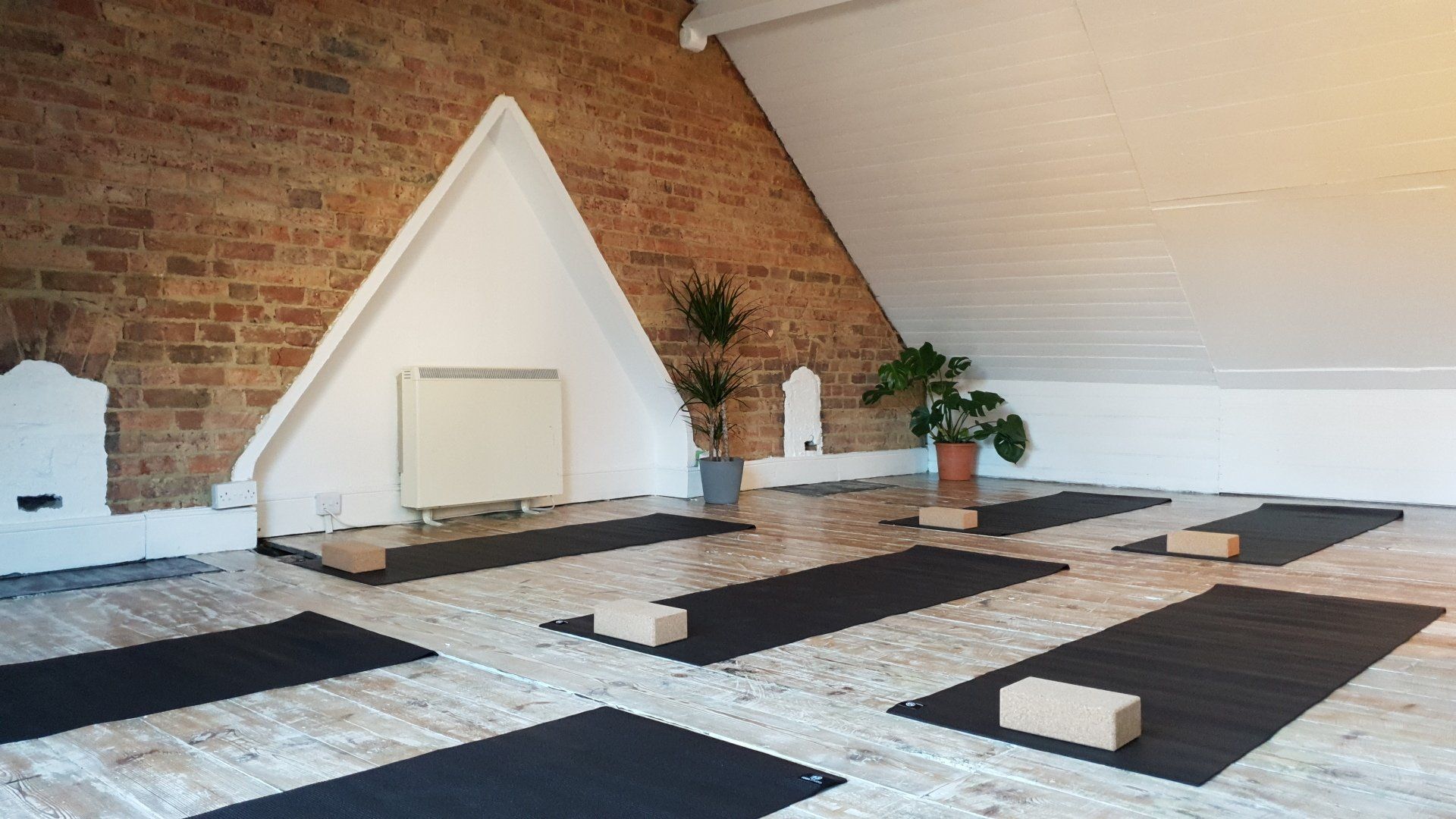 Grace Hill Studios' Loft Studio with yoga mats laid out ready for a class