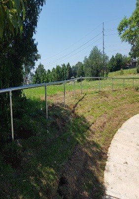 metal railing along grass