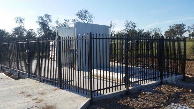 corner of black metal fence