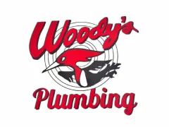 Woody's Plumbing logo: Red text and woodpecker on a circular target.