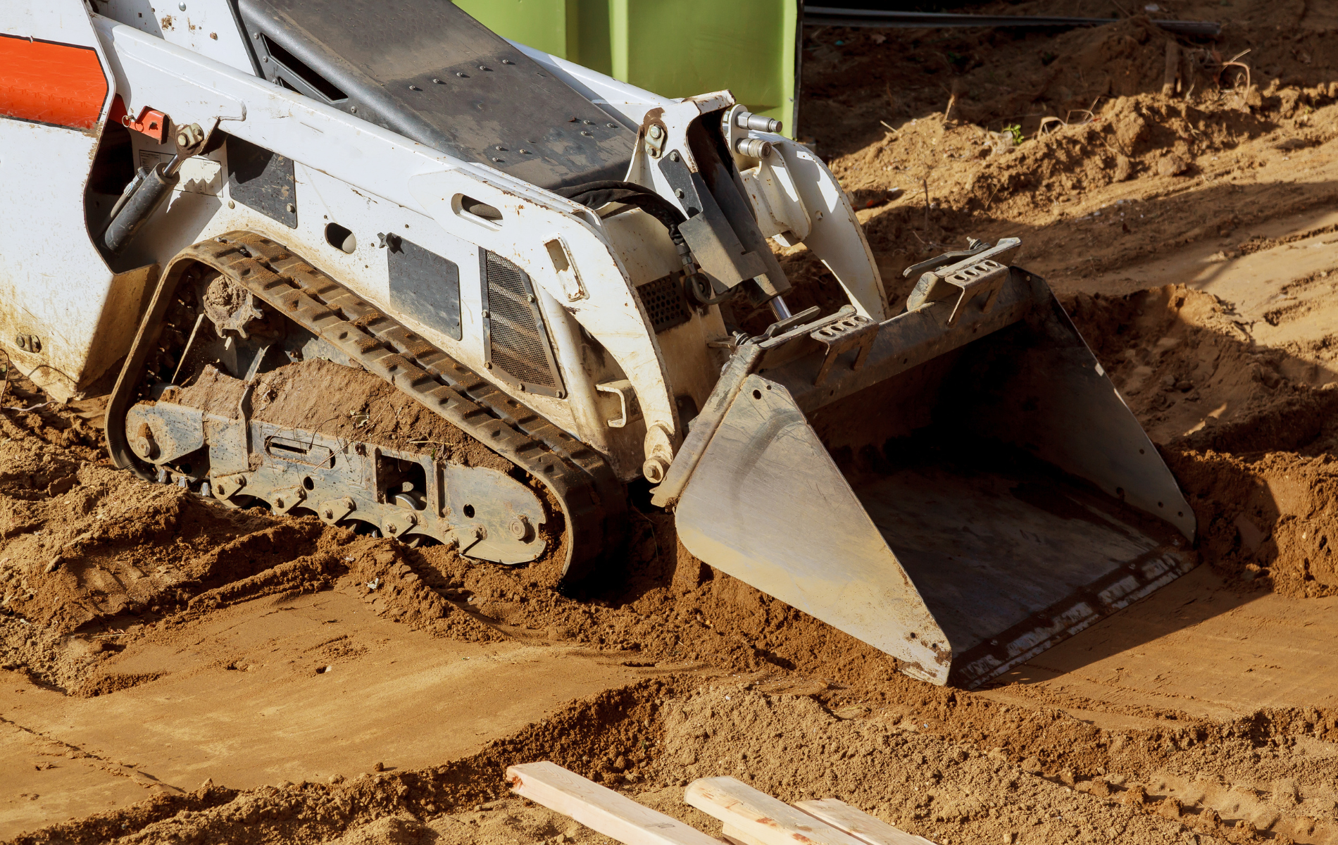 A bulldozer is moving dirt on a construction site.