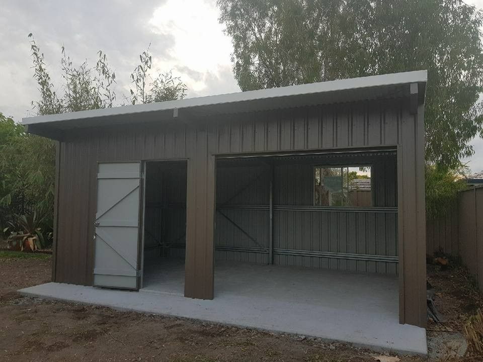 Brown Metal Shed With Two Bays: One With an Open Door and the Other With an Open Garage Door — North Coast Sheds & Garages in Mullumbimby, NSW