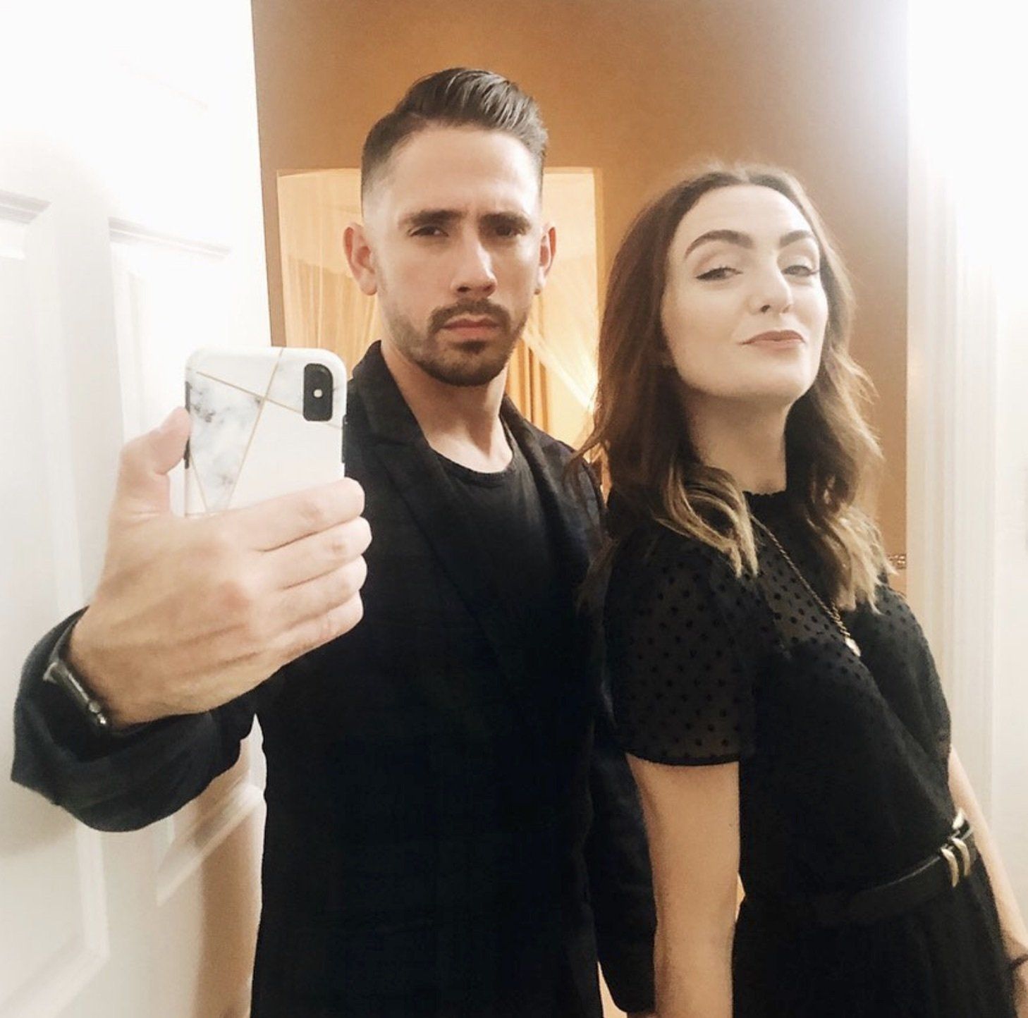 Gabriel and Debbie Mayes take a selfie with their iPhone to support their Instagram niche.