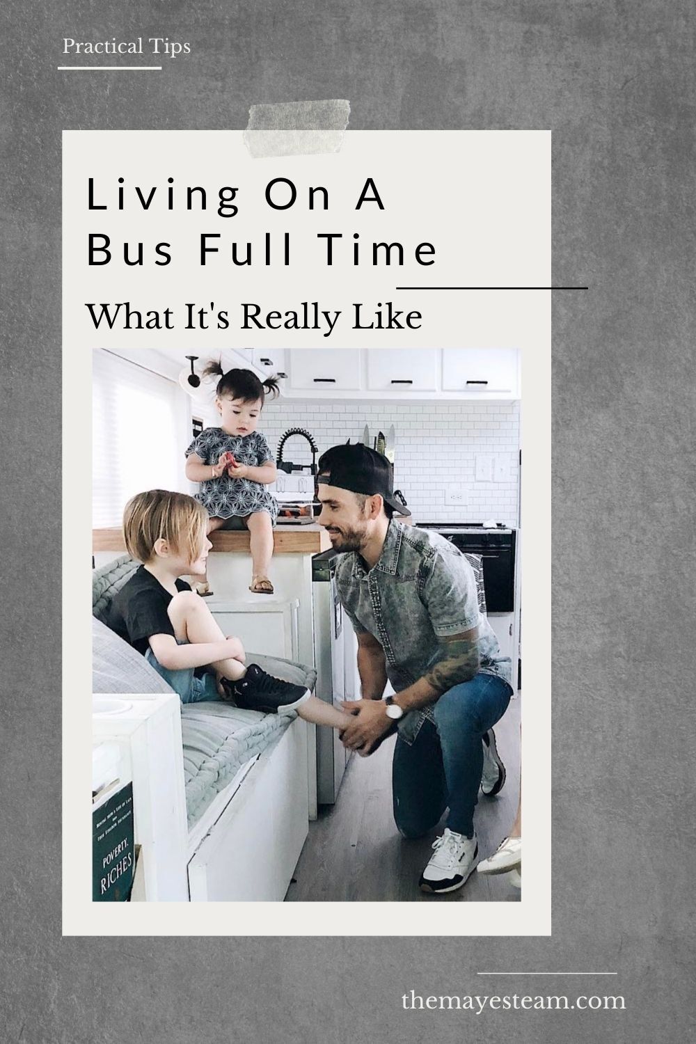 Gabriel Mayes helps his children get ready while they live on a bus full time. Image overlaid with text that reads Living On A Bus Full Time What It's Really Like.