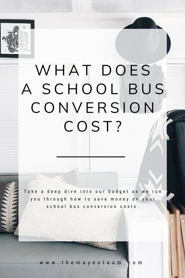 Photograph of modern living room in The Mayes Team skoolie bus with text overlaying it that reads What Does a School Bus Conversion Cost? Take a deep dive into our budget as we run you through how to save money on your school bus conversion costs.