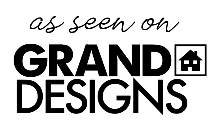 A black and white logo for grand designs with a house in a square.