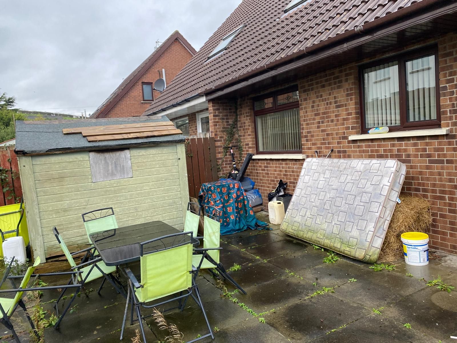 Back garden with rubbish