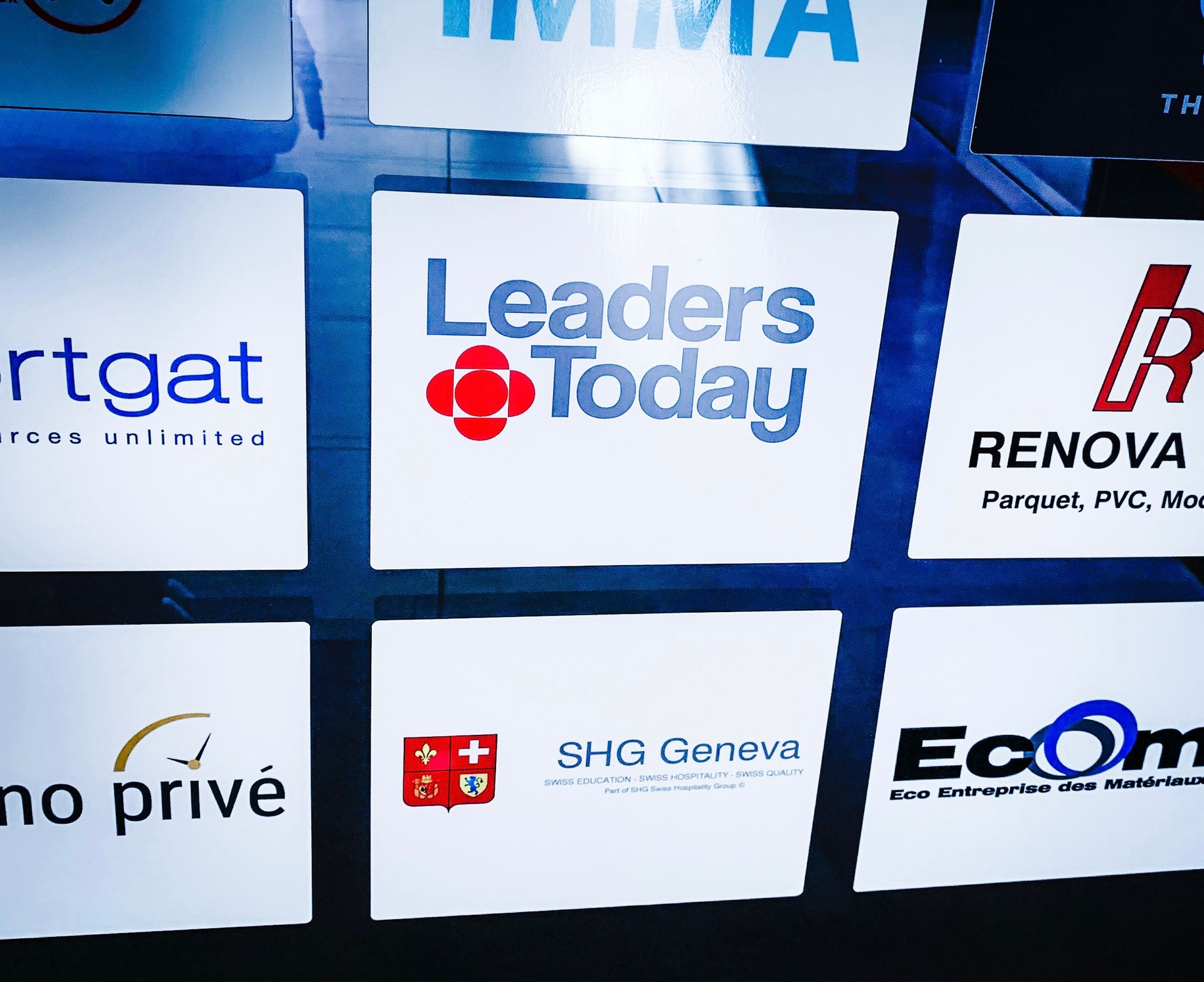 A display of various logos including Leaders Today.