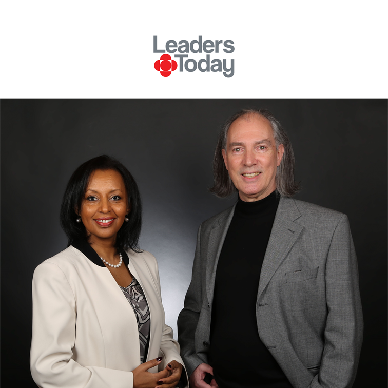 A man, Jean Francois Mathieu and a woman, Saba Imru-Mathieu are standing next to each other in front of the Leaders Today logo