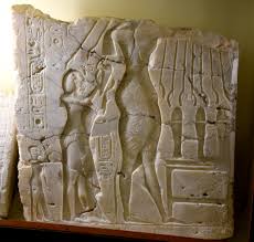 Akhenaten and Nefertiti receiving life from god Atun