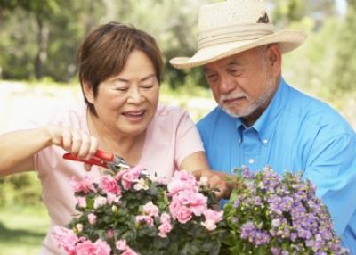 Senior Couple Trimming Flowers — Sandy Spring, MD — Brooke Grove Retirement Village