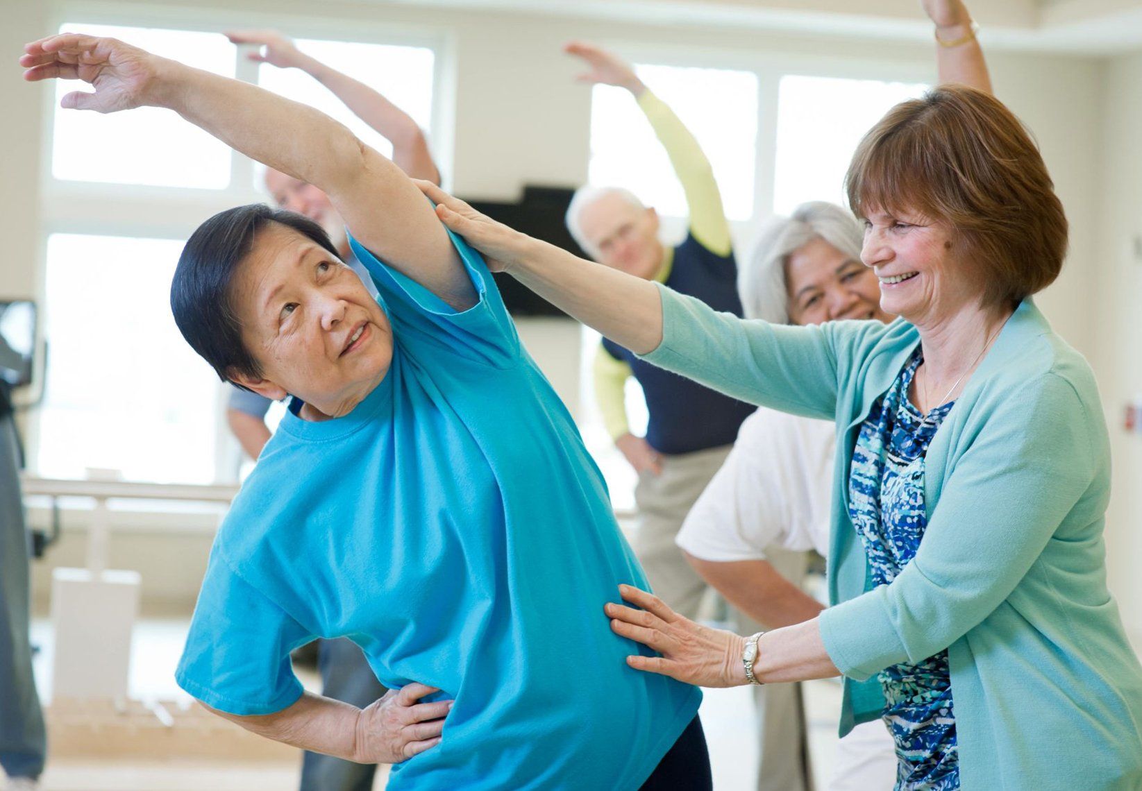 Assisted Living Referrals — Group Of Senior Citizen Doing Exercise In Spring, MD