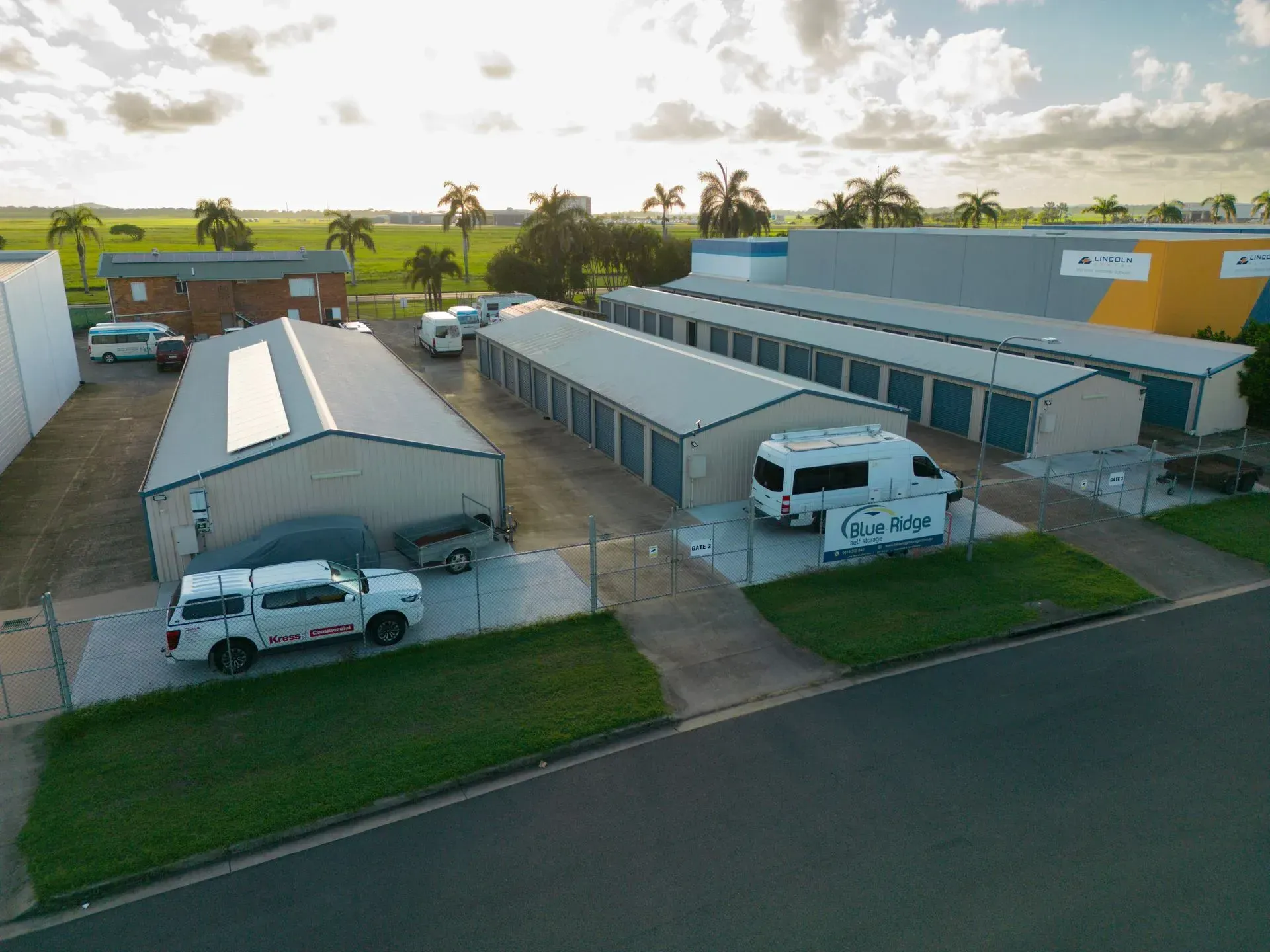 Storage Units with Gray Corrugated Metal Doors in A Brightly Lit Hallway — Blue Ridge Self Storage In Paget, QLD